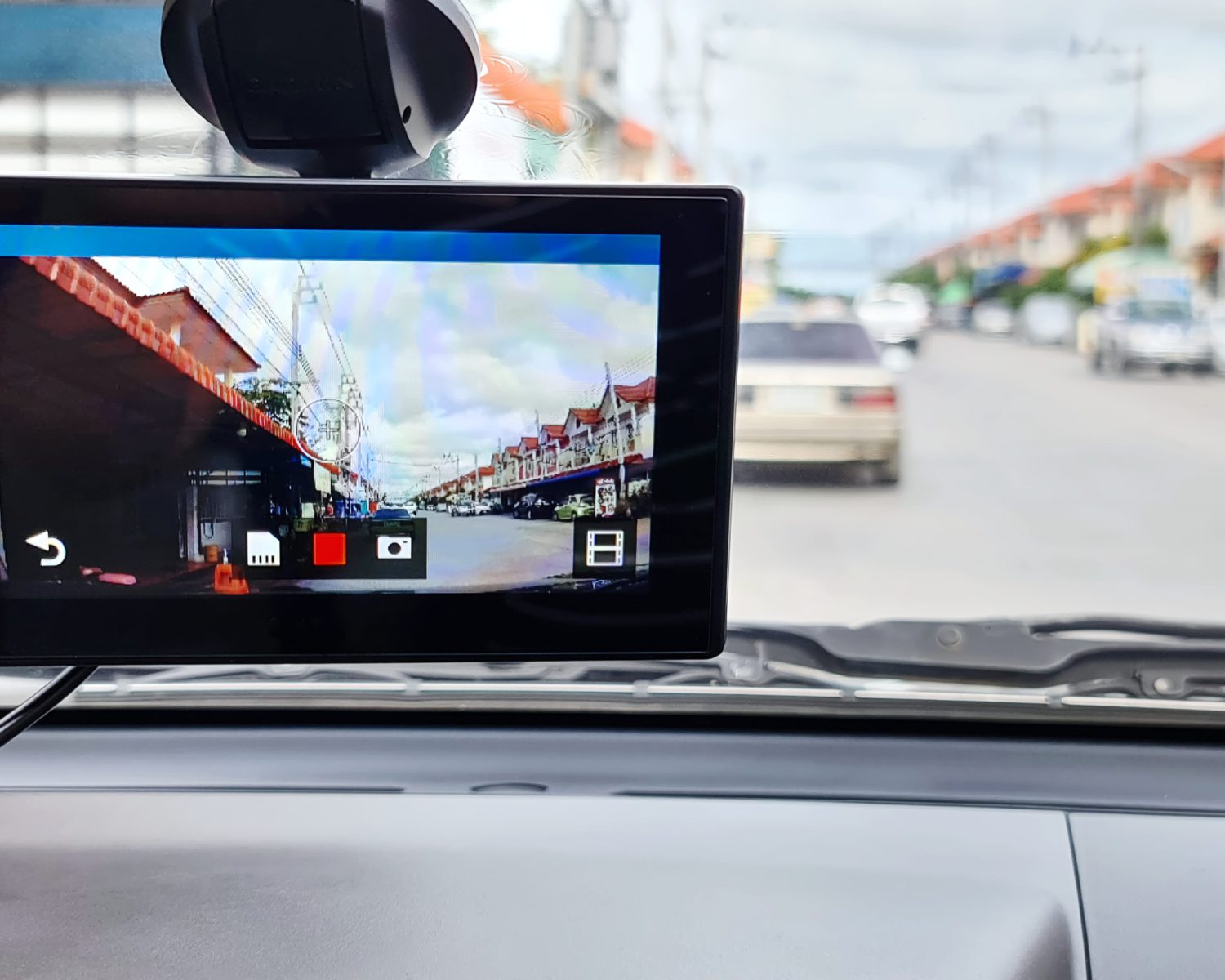 Close-up Camera Screen of Front Car Windshield