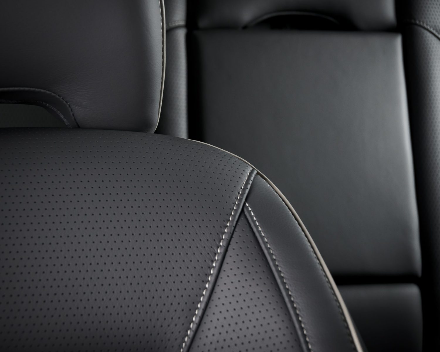 Modernluxury race car  black perforated leather interior. Part of  leather car headrest black seat details.